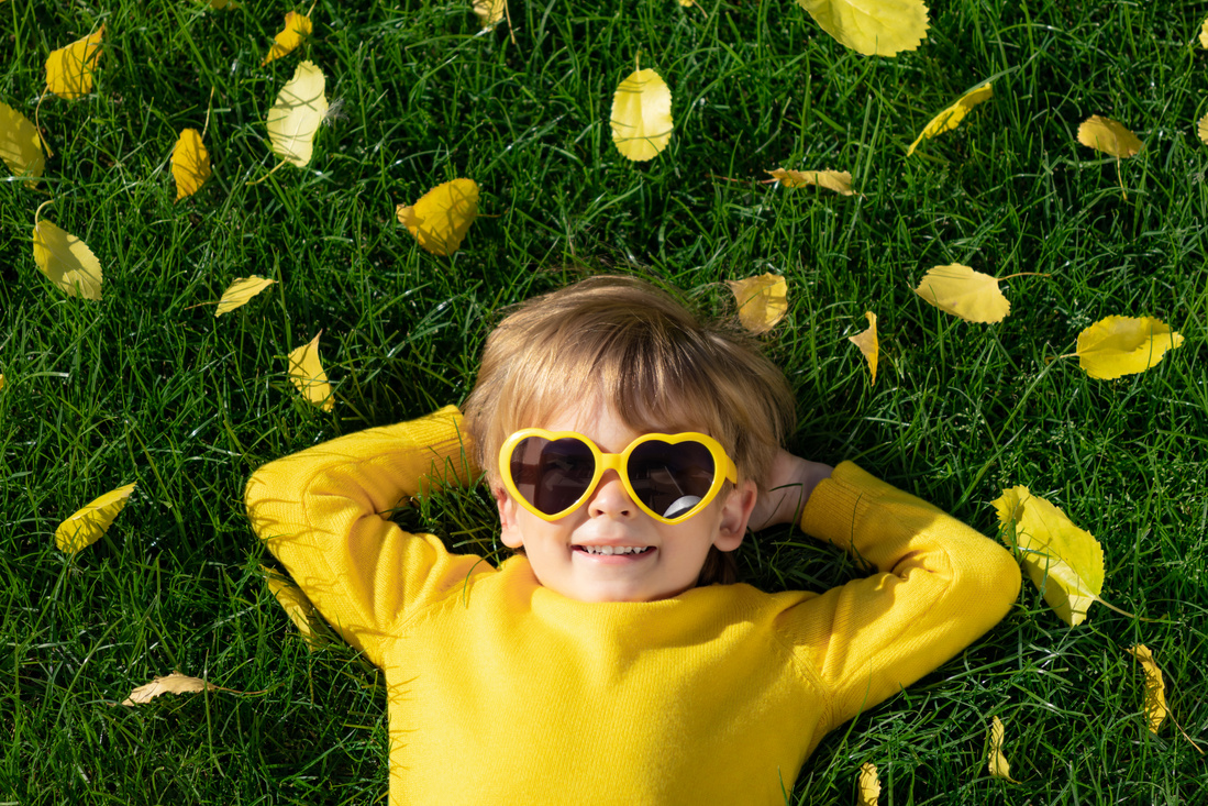 Happy Child Lying on the Grass